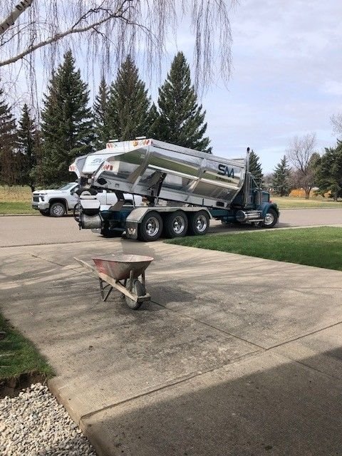 Hydrovac hose excavating around a foundation