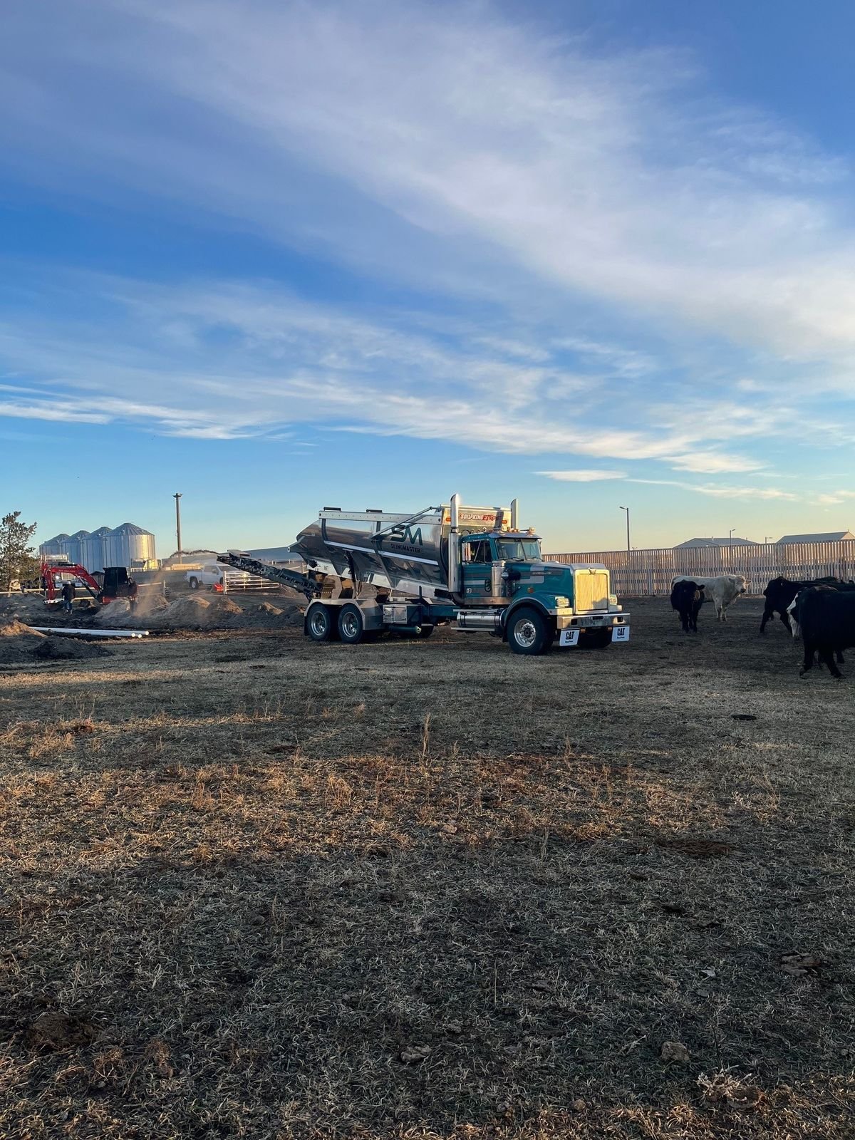 Stone slinger placing gravel